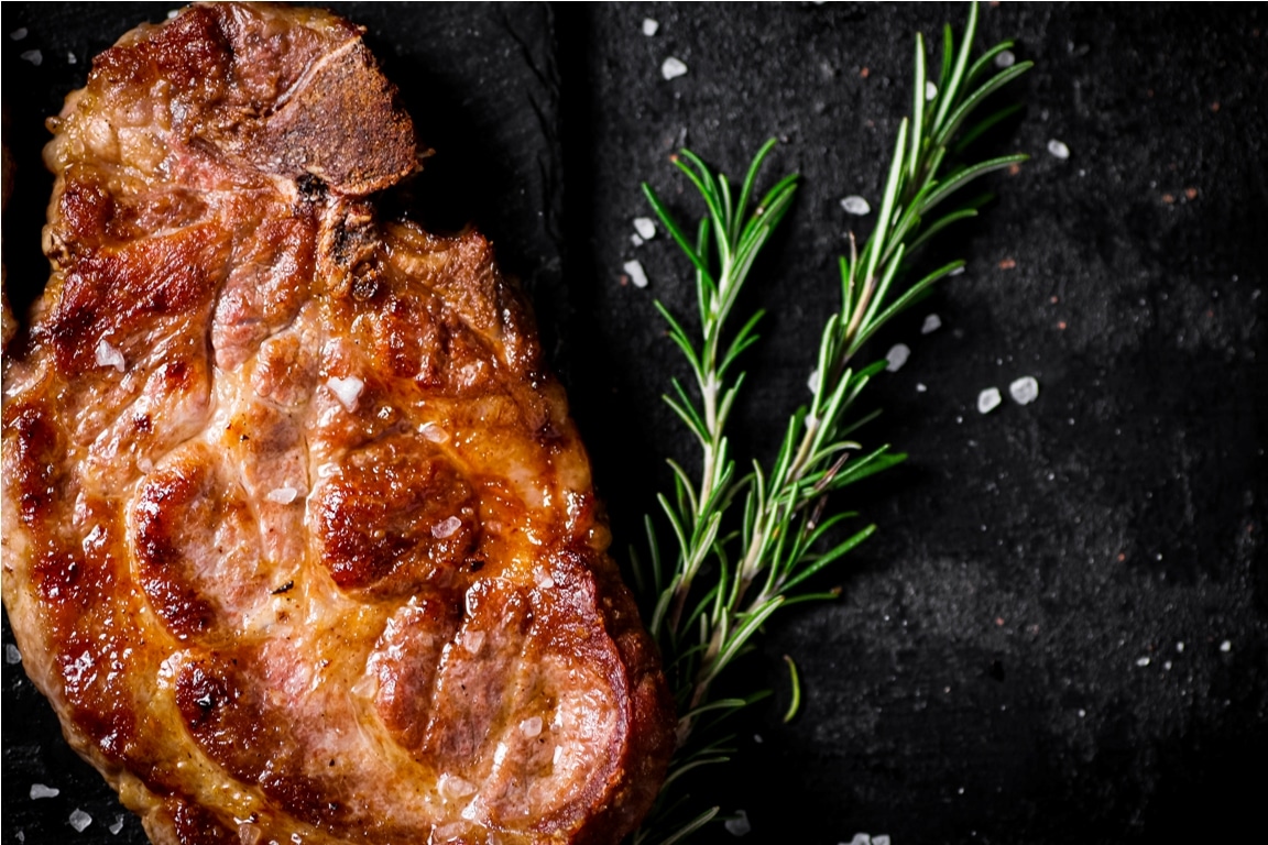 grilled pork steak with a sprig of rosemary 2023 11 27 05 12 16 utc