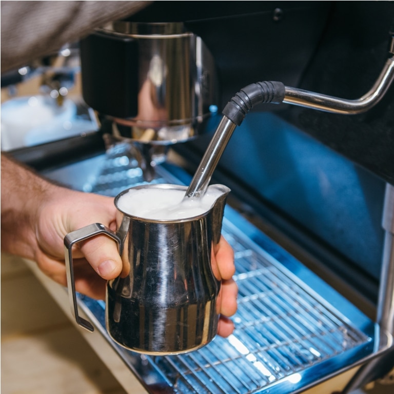 making milk froth with espresso coffee machine