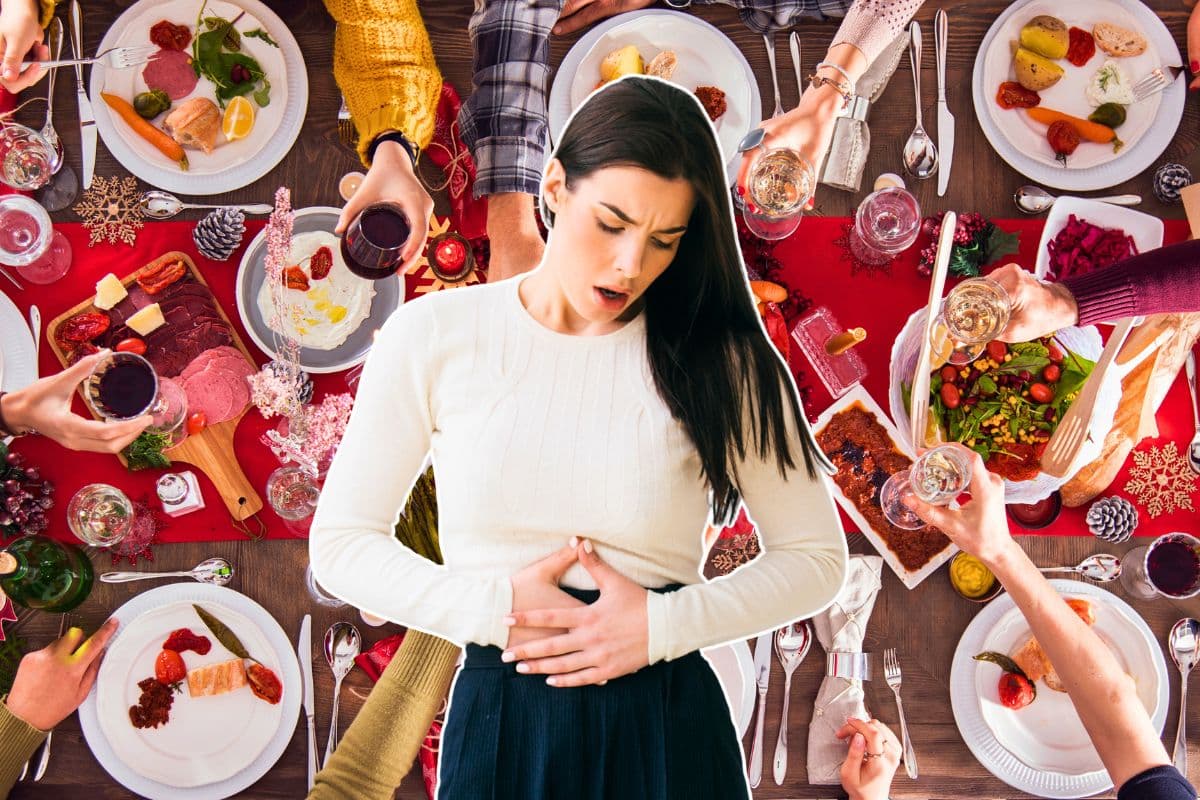 Femme avec maux d'estomac lors d'un repas festif.