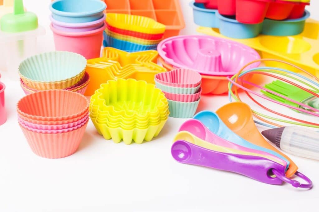Colorful silicone baking molds and measuring spoons.
